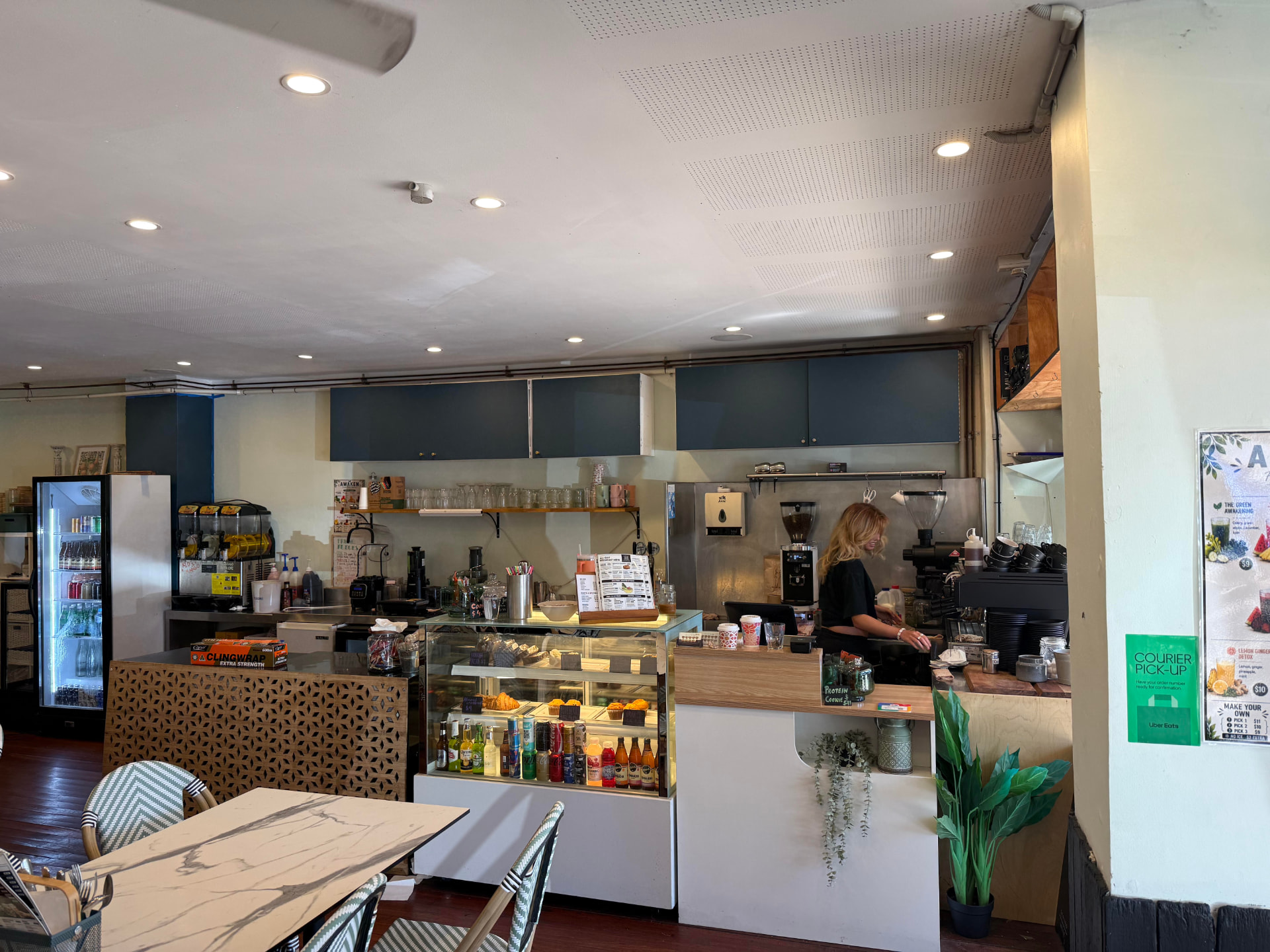 Awaken Avalon interior counter with display cabinet, coffee machine and staff making drinks