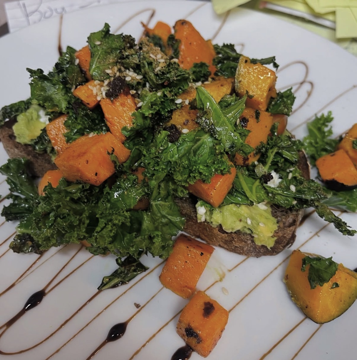 Roast pumpkin, kale and avocado bruschetta with feta and balsamic on sourdough